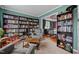 This cozy living room features built-in bookshelves, comfortable seating, and a view to the dining room at 76 Haywood St, Spring Lake, NC 28390