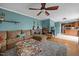 Inviting living room featuring hardwood floors, comfortable seating, and an open layout to the kitchen at 76 Haywood St, Spring Lake, NC 28390
