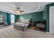 Spacious main bedroom featuring a tray ceiling, ceiling fan, and neutral carpet at 76 Haywood St, Spring Lake, NC 28390