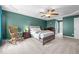 Spacious main bedroom featuring a tray ceiling, ceiling fan, and neutral carpet at 76 Haywood St, Spring Lake, NC 28390