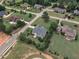 Neighborhood aerial view showing a well-kept home with mature trees and greenery surrounding the property at 7800 Twin Pines Way, Fuquay Varina, NC 27526