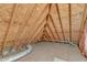 Spacious unfinished attic with exposed wood beams and ductwork at 7800 Twin Pines Way, Fuquay Varina, NC 27526
