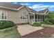 The home's patio transitions to the screened in porch and gives way to mature trees and lush lawn at 7800 Twin Pines Way, Fuquay Varina, NC 27526