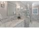 Luxurious marble bathroom featuring modern fixtures, frameless glass shower, and an elegant vanity at 7800 Twin Pines Way, Fuquay Varina, NC 27526