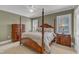 Traditional bedroom showcasing a four-poster bed, side tables, and green walls at 7800 Twin Pines Way, Fuquay Varina, NC 27526