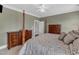 Inviting bedroom featuring a four-poster bed and ample storage in matching dressers at 7800 Twin Pines Way, Fuquay Varina, NC 27526