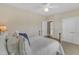 Comfortable bedroom featuring a four-poster bed, ceiling fan, and ample natural light at 7800 Twin Pines Way, Fuquay Varina, NC 27526
