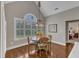 Charming dining area with hardwood floors, and a round table under a decorative chandelier at 7800 Twin Pines Way, Fuquay Varina, NC 27526