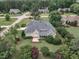 Beautiful single-story home featuring a covered porch, lush landscaping, and a well-maintained lawn at 7800 Twin Pines Way, Fuquay Varina, NC 27526
