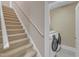 Convenient laundry area with modern washer and dryer set near carpeted stairs at 7800 Twin Pines Way, Fuquay Varina, NC 27526