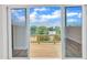 View from inside looking out to back porch and lake at 816 Lilyquist Way, Wake Forest, NC 27587