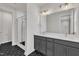 Bathroom featuring a double vanity, modern fixtures, and a walk-in shower at 816 Lilyquist Way, Wake Forest, NC 27587