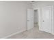 Bedroom with neutral walls, carpet flooring and a double door closet at 816 Lilyquist Way, Wake Forest, NC 27587