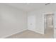 Bedroom featuring neutral walls, carpet flooring and a closet with double doors at 816 Lilyquist Way, Wake Forest, NC 27587