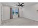 Bedroom with neutral walls, carpet flooring, ceiling fan and a window overlooking the yard at 816 Lilyquist Way, Wake Forest, NC 27587