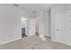 Bright bedroom with ensuite bathroom access, featuring neutral carpet and freshly painted walls at 816 Lilyquist Way, Wake Forest, NC 27587