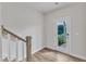 Entryway featuring modern wood flooring, staircase, and backyard access door at 816 Lilyquist Way, Wake Forest, NC 27587