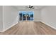 Open living room with hardwood floors and sliding glass doors leading to outdoor patio at 816 Lilyquist Way, Wake Forest, NC 27587