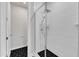 The shower features glass doors, matte black tiling and modern shower head fixtures at 816 Lilyquist Way, Wake Forest, NC 27587
