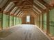 Unfinished attic space with wood framing, ready for customization, offering plenty of room for storage at 82 Laramie Ln, Selma, NC 27576