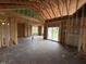 Spacious living room showing wooden framework, ample natural light, sliding glass doors to the outside at 82 Laramie Ln, Selma, NC 27576