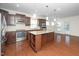 Open kitchen design with stainless steel appliances, granite countertops, and a spacious island at 826 Downfield Ln, Fuquay Varina, NC 27526