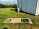 Backyard with a septic tank and an air conditioning unit at 8365 Aaron Creek Church Rd, Oxford, NC 27565