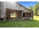 Rustic open-air barn with exposed beams and weathered wood, set in a serene outdoor setting at 8365 Aaron Creek Church Rd, Oxford, NC 27565