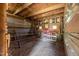 Barn interior featuring weathered wood, tin siding, and functional features, providing ample space and rustic charm at 8365 Aaron Creek Church Rd, Oxford, NC 27565
