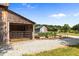 Exterior view of barn featuring an attached shed with gated access, alongside a garden and ample outdoor space at 8365 Aaron Creek Church Rd, Oxford, NC 27565