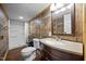 Stylish bathroom featuring rustic wood paneling, a modern vanity and shower; perfect for a spa-like experience at 8365 Aaron Creek Church Rd, Oxford, NC 27565