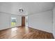 Bedroom features light colored walls and floors, and natural light from the window at 8365 Aaron Creek Church Rd, Oxford, NC 27565