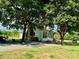 Quaint home with charming curb appeal, mature trees, and a serene setting, perfect for peaceful living at 8365 Aaron Creek Church Rd, Oxford, NC 27565