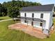 Metal roof covers the front porch of this charming farmhouse, surrounded by an expansive yard at 8365 Aaron Creek Church Rd, Oxford, NC 27565