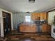 Traditional kitchen featuring warm wood cabinets and stainless steel appliances at 8365 Aaron Creek Church Rd, Oxford, NC 27565