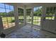 Bright sunroom with large windows, providing ample natural light and serene outdoor views at 8365 Aaron Creek Church Rd, Oxford, NC 27565