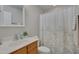 Clean bathroom with modern fixtures, a shower-tub combo, and a stylish vanity at 8404 Saltwood Pl, Raleigh, NC 27617