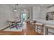 Open floor plan with dining table and seating flowing into the kitchen space at 8404 Saltwood Pl, Raleigh, NC 27617
