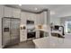 Well-equipped kitchen with stainless appliances, white countertops, and ample storage space at 8404 Saltwood Pl, Raleigh, NC 27617