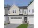 Charming townhome featuring a two-car garage, neutral siding and a welcoming entrance at 8935 Kennebec Crossing Dr # 57, Angier, NC 27501