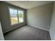 Bedroom with neutral walls, carpet and a window providing natural light at 90 Brookhaven Dr, Spring Hope, NC 27882