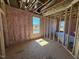 Bright bedroom with natural light, insulation, and framing, ready for customization at 90 Brookhaven Dr, Spring Hope, NC 27882