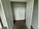 Open closet with white doors and single rack for storage in new home at 90 Brookhaven Dr, Spring Hope, NC 27882