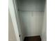 Open closet with a single wire rack for storage with open white doors at 90 Brookhaven Dr, Spring Hope, NC 27882