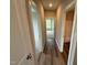 Hallway with wood floor and doorways to the bedroom and bathroom at 90 Brookhaven Dr, Spring Hope, NC 27882