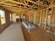 Spacious interior with exposed framing and insulation, awaiting final construction at 90 Brookhaven Dr, Spring Hope, NC 27882