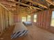 Sunlit interior with insulation and exposed framing, ready for drywall and finishing touches at 90 Brookhaven Dr, Spring Hope, NC 27882