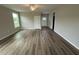 Bright living room featuring light walls, wood floors, and natural light from the window at 90 Brookhaven Dr, Spring Hope, NC 27882