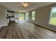 Inviting open concept with living area flowing into kitchen and access to the outdoor deck at 90 Brookhaven Dr, Spring Hope, NC 27882