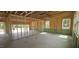 Unfinished interior featuring stud walls, multiple windows, and garage access at 91 Caspian Ct, Lillington, NC 27546